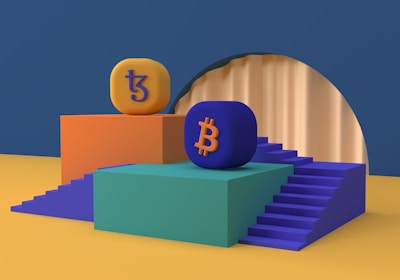 Two platform structures with stairs are positioned side by side. One platform is orange with an orange and purple 'Tezos' symbol on top, while the other is green with a blue and orange 'Bitcoin' symbol. The platforms are set on a blue and mustard yellow background, and there is a large circular arch in the backdrop.